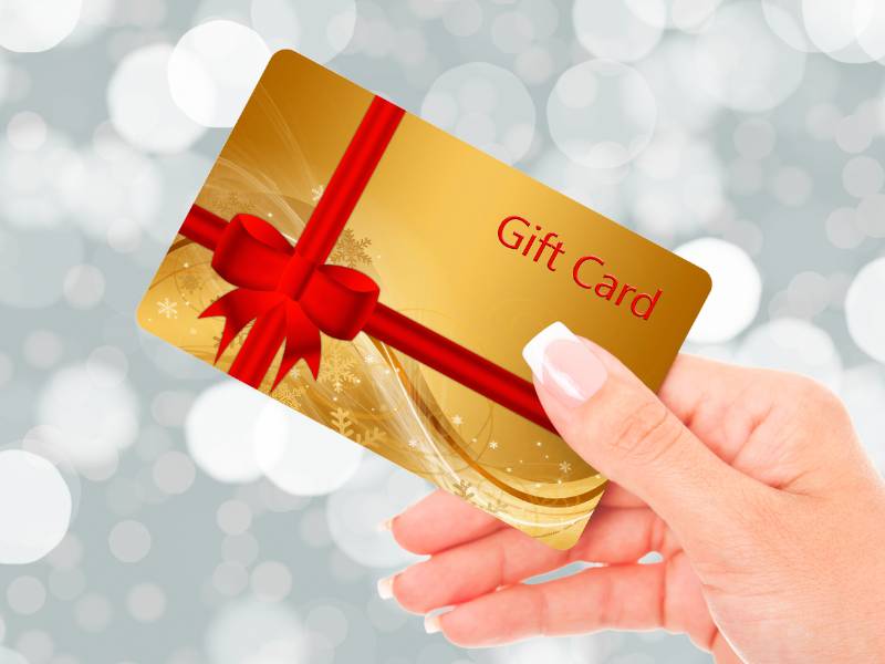 holiday gift card women receiving spa facial